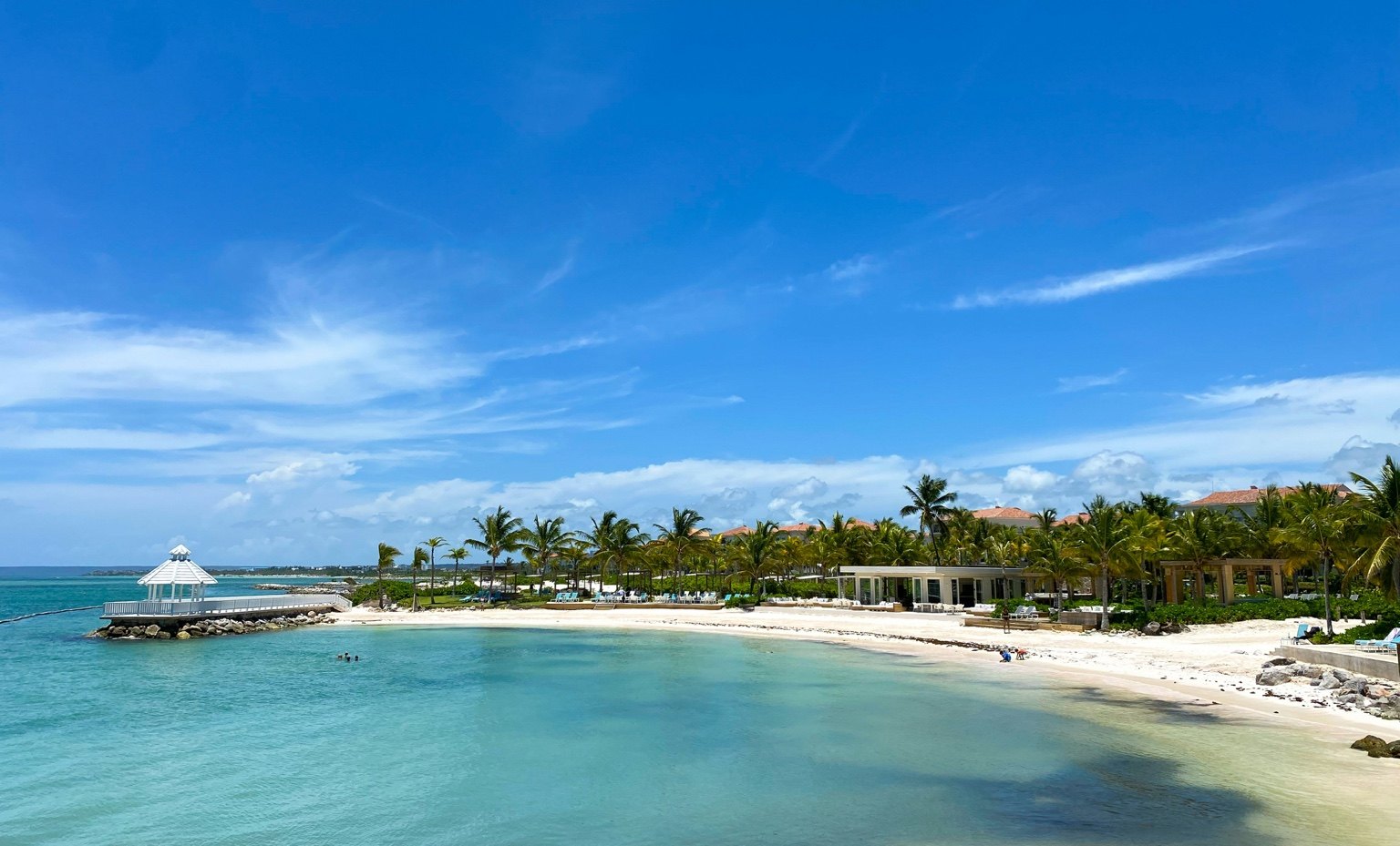 Wooden pier leading to a tropical beach resort in Punta Cana