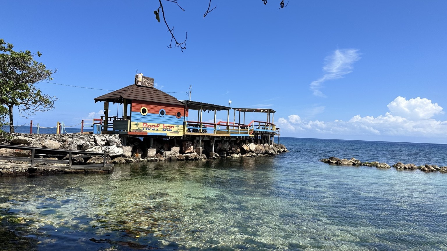 Colorful seaside Reef Bar in Jamaica, photographed by Twilight Travel