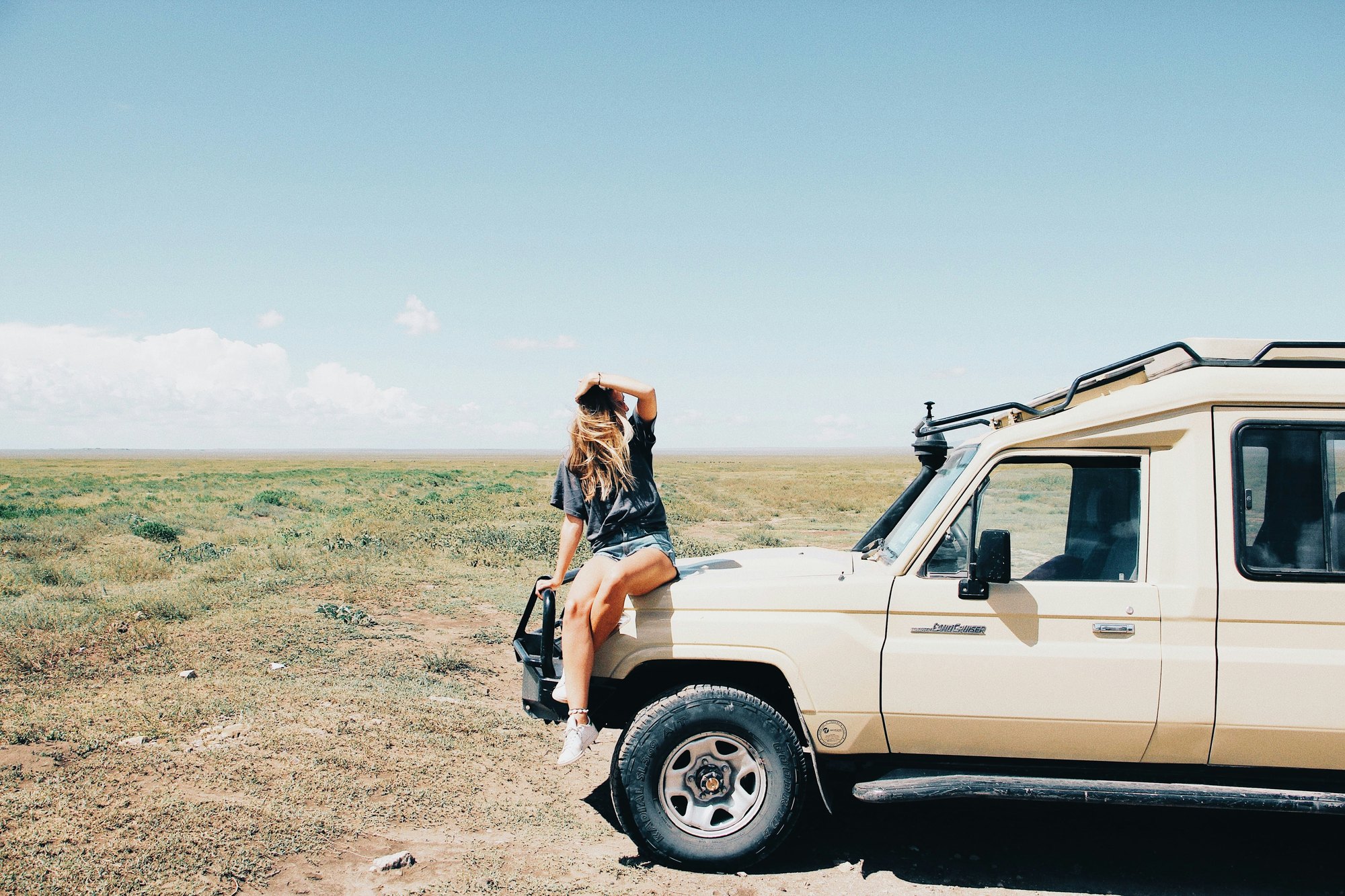 Travelers setting out on an African safari game drive