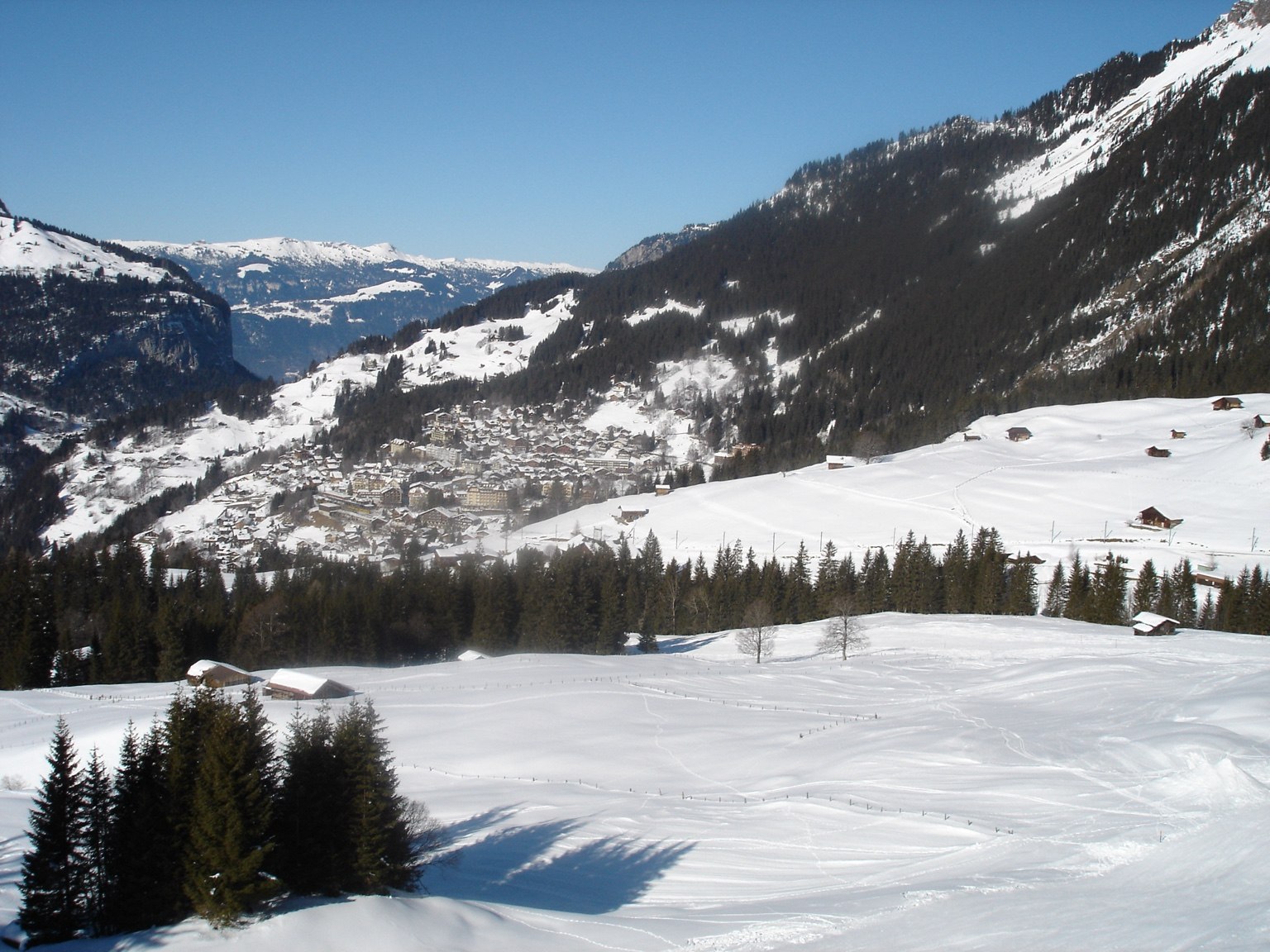 Snow-covered Alpine village surrounded by mountains